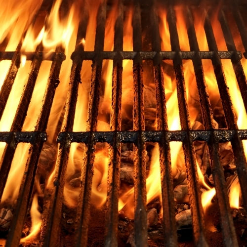 Glowing braai coals and open flame